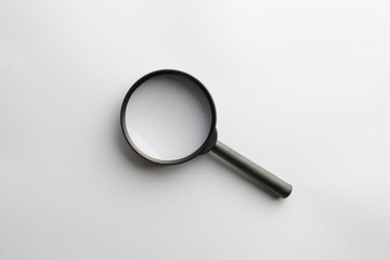Magnifying glass for search on white background