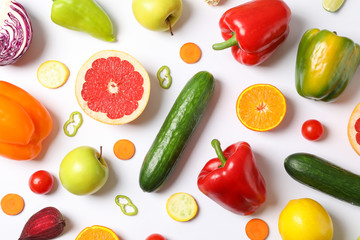 Different vegetables and fruits on white background, top view