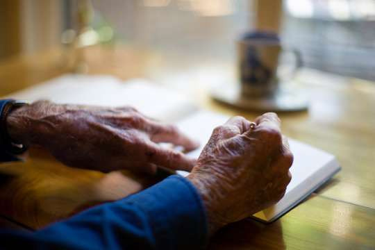 Senior man writing at his desk