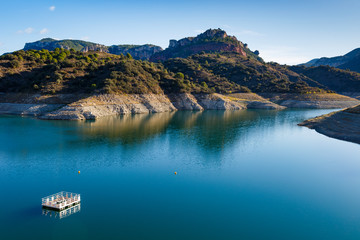 View of almost empty Siurana water reservoir, Tarragona, Spain