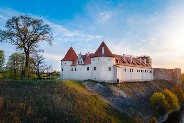 Fototapeta na wymiar Bauska town aerial panorama with Bauska medieval castle in sunset.