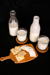 Fresh dairy products on an old kitchen board.