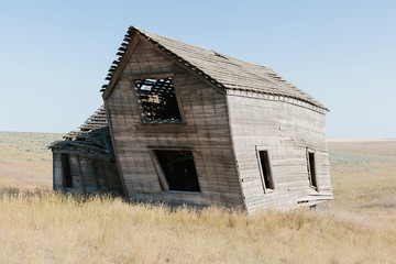 Abandoned farmhouse in grassland