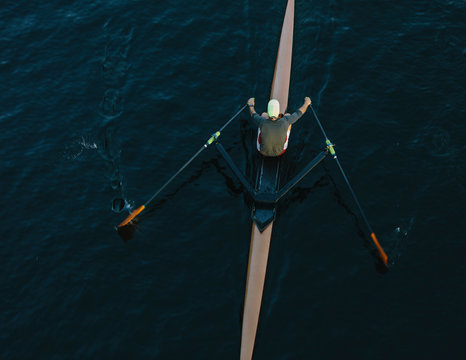 View from above of single scull crew racer, Lake Union, Seattle, Washington, USA.
