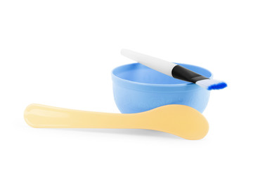 Bowl and mask brush on a white background
