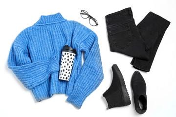 Set of stylish winter clothes on white background, top view