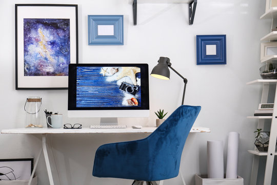 Home workplace with modern computer and desk in room