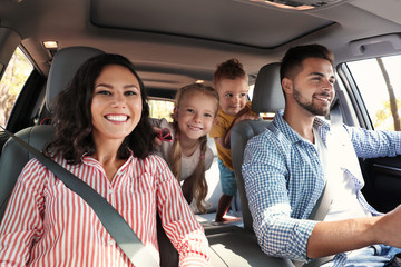 Happy family in car on road trip - obrazy, fototapety, plakaty