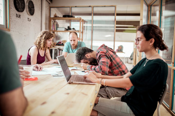 Carpenters working in office at workshop