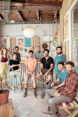 Portrait of smiling confident colleagues in workshop