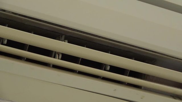 The air conditioner turns on and opens the baffles for fresh air