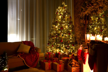 Stylish room interior with beautiful Christmas tree in evening