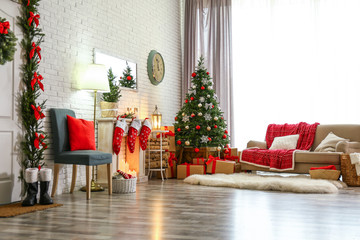 Stylish interior with Christmas tree and decorative fireplace