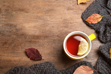 Flat lay composition with hot drink on wooden background, space for text. Cozy autumn