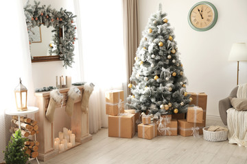 Stylish Christmas interior with beautiful decorated tree and fireplace