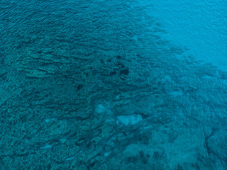 blue water in the ocean - picture taken by a drone