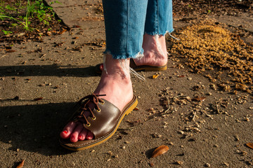 Handmade leather sandals from the Florida Keys. Slip-ons with laces to adjust for size. Square-toed with a short block heel.