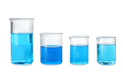 Laboratory glassware with blue liquids isolated on white