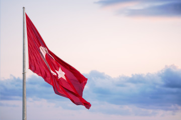 Turkey Flag surges above a cloudy evening sky
