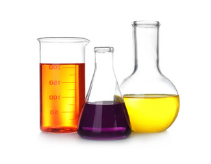 Laboratory glassware with color liquids on white background