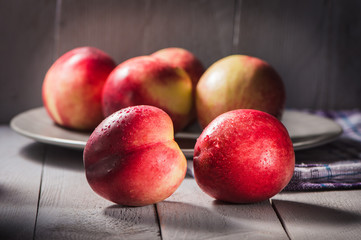 Fresh fruit nectarines healthy food.Harvest red and fresh nectarines . Pile of sweet fruits