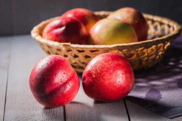 Fresh fruit nectarines healthy food.Harvest red and fresh nectarines . Pile of sweet fruits