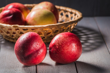 Fresh fruit nectarines healthy food.Harvest red and fresh nectarines . Pile of sweet fruits