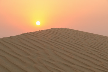 Sunset over a dune ridge in the Rub Al Khali Desert, Abu Dhabi