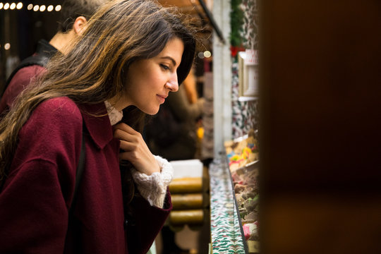 Young woman shopping on Christmas market