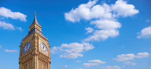 Big Ben Clock Tower in London, UK, on a bright day, panoramic image