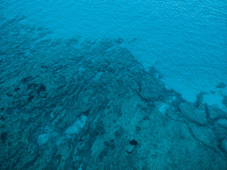 blue water in the ocean - picture taken by a drone