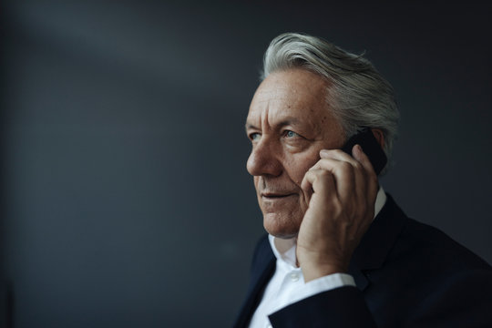 Portrait Of A Senior Businessman Talking On Cell Phone