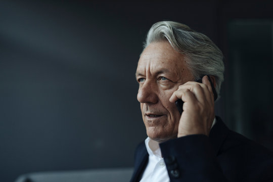 Portrait of a senior businessman talking on cell phone