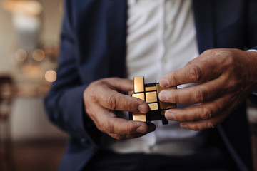 Close-up of businessman with Rubik's Cube