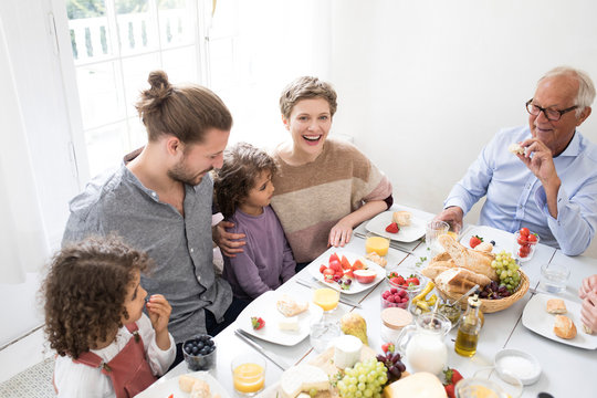 Happy Extended Family Having Lunch At Home