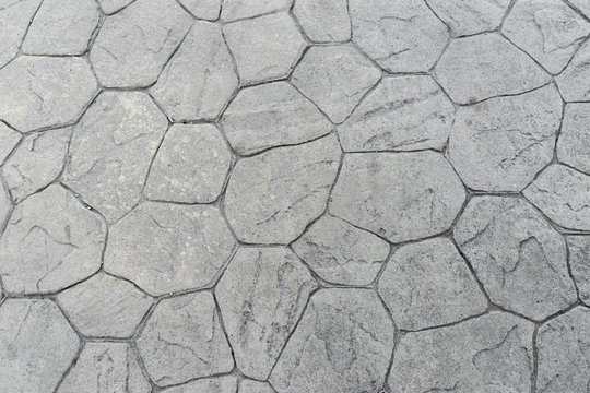 Fondo de pavimento de hormigón impreso con textura irregular