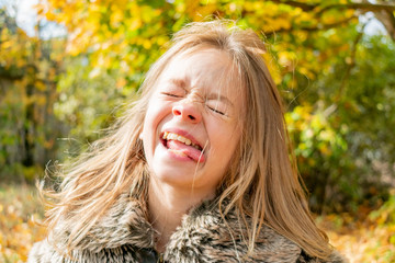 Little girl in autumn clothes