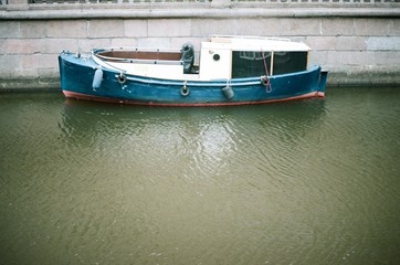 vintage pleasure boats in the city canal. film photography