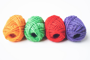 Colorful yarn balls as isolated white background, close up