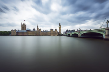 Fototapeta premium Panoramic view of Houses of Parliament, Big Ben and Westminster Bridge with reflection, London