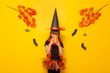 Little girl in witch costume for Halloween
