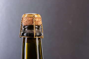 Closeup of champagne bottle and cork. plaque, muzzle