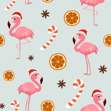 Winter christmas pattern with flamingo, orange, cinnamon and sweets. Vector seamless texture.