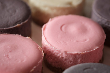 Pastel color round cheesecakes. Colorful cheesecake. Filled frame space. Dessert pattern