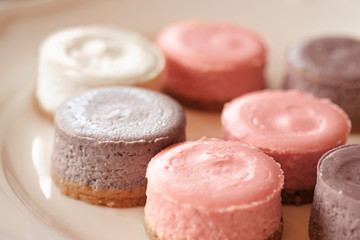 Pastel color round cheesecakes. Colorful cheesecake. Filled frame space. Dessert pattern