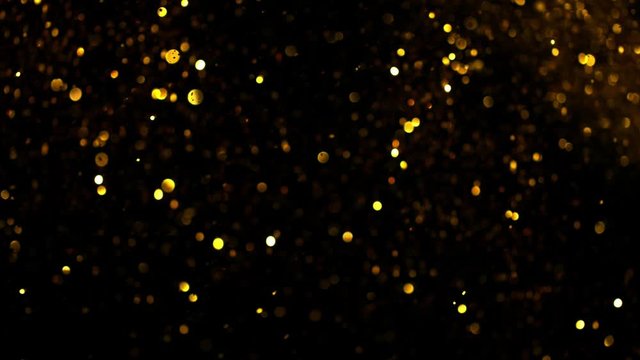 Golden Glitter Background in Super Slow Motion at 1000fps. Shooted with High Speed Cinema Camera in 4K Resolution.