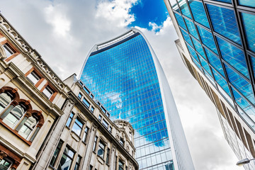 Low angle view of skyscrapers. Looking up perspective. Bottom view of modern skyscrapers in...