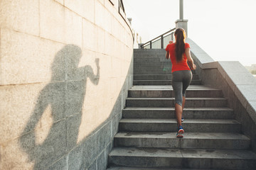 Young fitness woman running outdoor