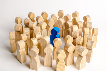 The blue figure of the leader is surrounded by a crowd of people. Leadership and team management,...