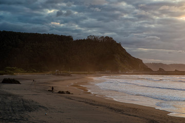 Sunset on Asturias beach. Clouds over the Cantabrian Sea